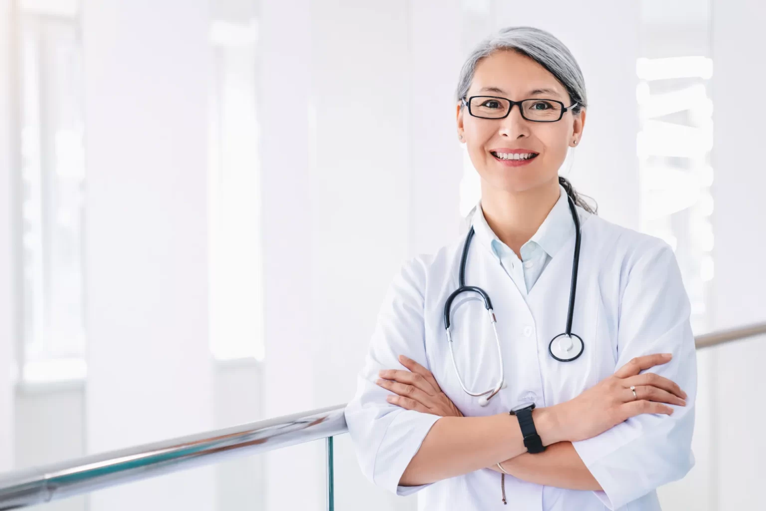 portrait of middle aged asian female doctor standi utc